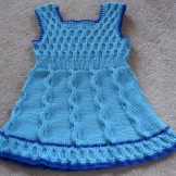 Knitted dress for girls with A-line knitting needles