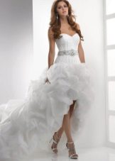 A wedding dress with a full skirt and a train