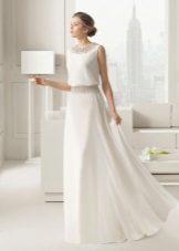 A wedding dress from Rosa Clara with a belt that repeats the decor