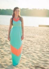 Sea-green dress with coral accents and jewelry