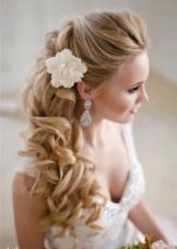 Hairstyle with fabric flowers for a wedding dress