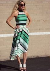 Dress of medium length in green, black, white stripes