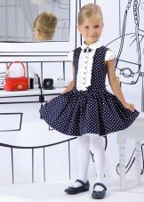 Elegant blue dress with white polka dots for a girl