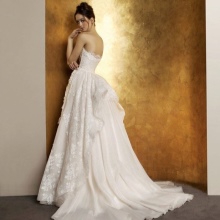 Luxurious wedding dress with a train of a brush