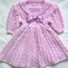 Knitted dress for girls with knitting needles