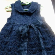Knitted dress for girls with knitting needles