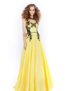 Yellow evening dress with a black pattern