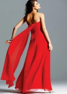 Red evening dress with an open back and a batto train