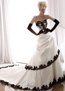 wedding dress with black lace around the edges of the skirt