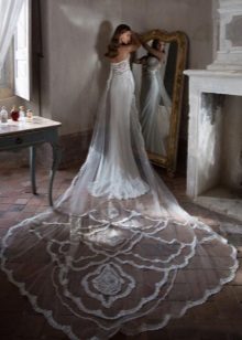 Wedding dress with a long lace train
