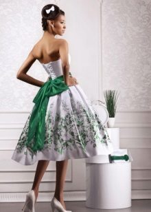 Wedding dress with a green belt and a pattern