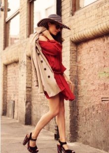 Beige trench coat, hat and bright striped terracotta dress sandals