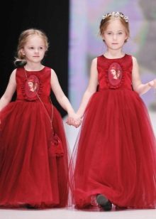 Elegant fluffy red floor-length dress for a girl