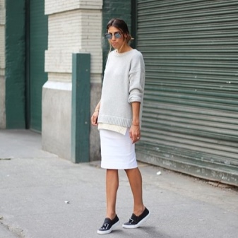 White pencil skirt with black sneakers and a gray sweatshirt