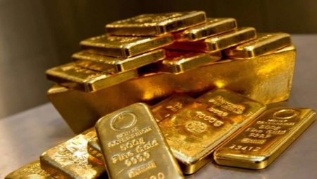 How much does an ounce of gold weigh and where is it used?
