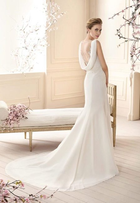 Elegant wedding dress with an open back and a train